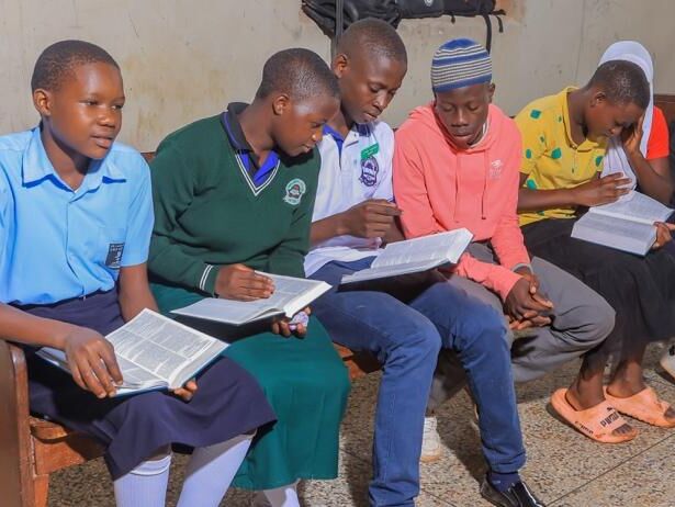 Five young men reading Bibles