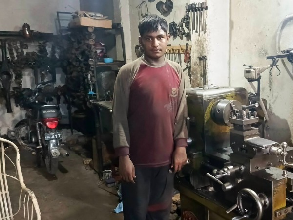 A young man in a workshop