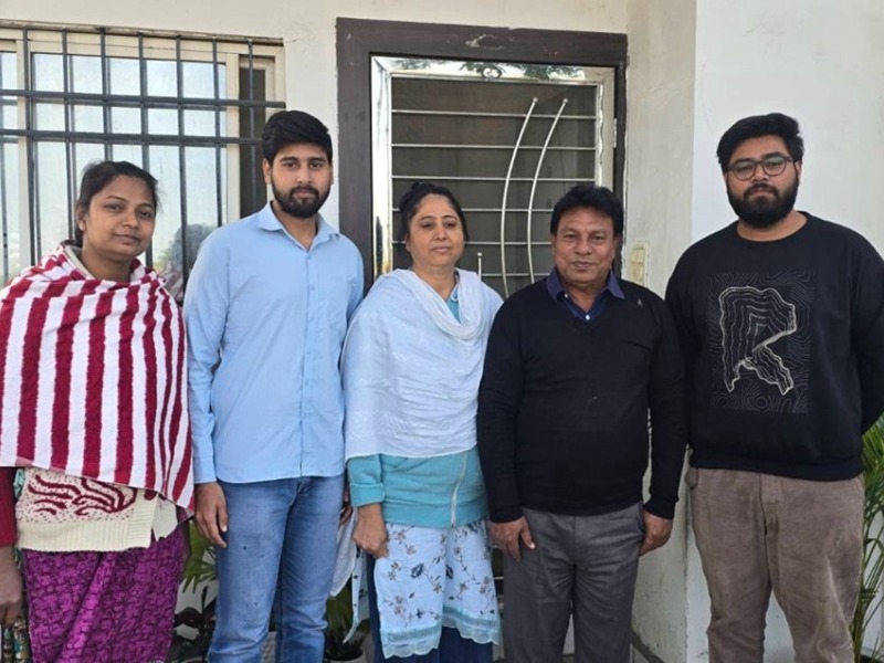 A family group of two women, two young men and one older man