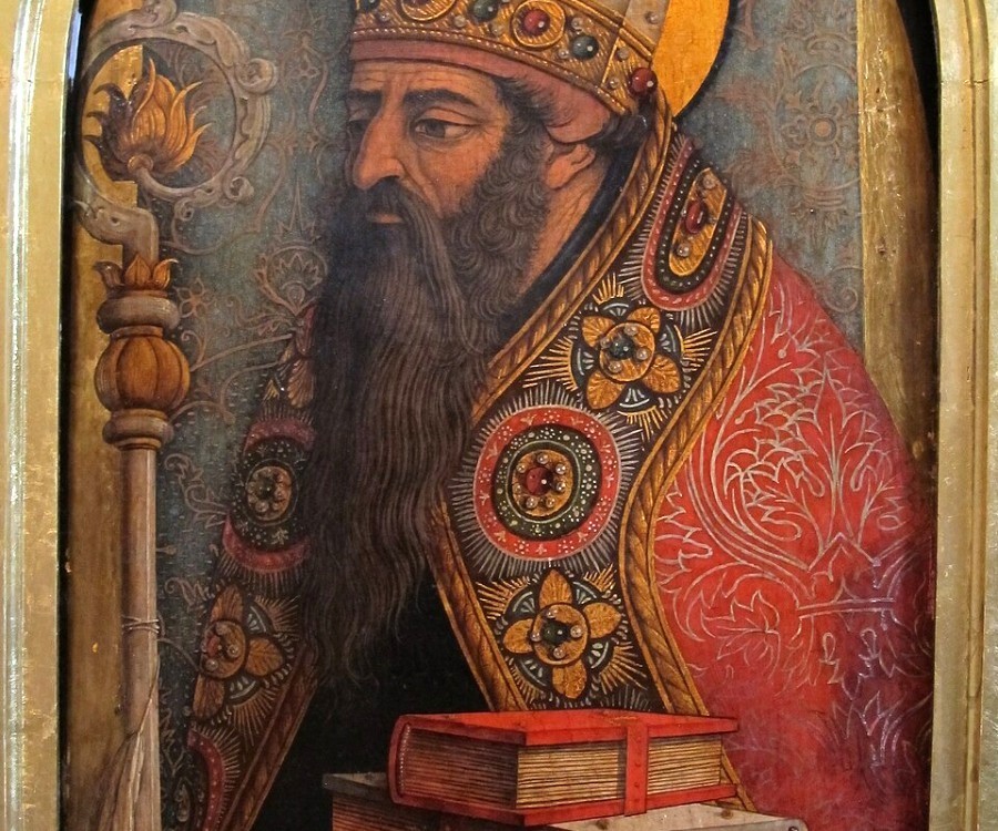 A man with a beard, wearing a mitre and holding a crozier, also holding books