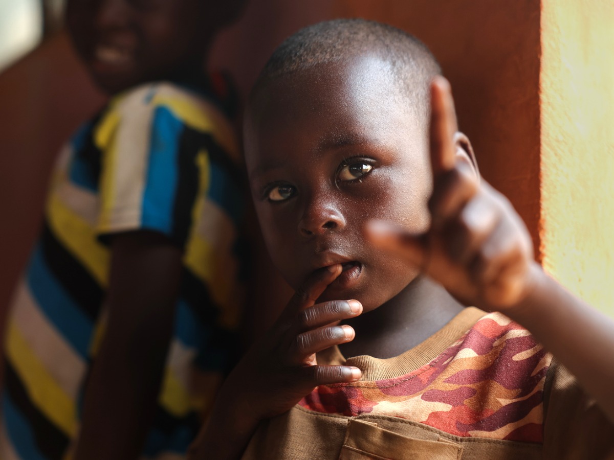Young boy looks to camera