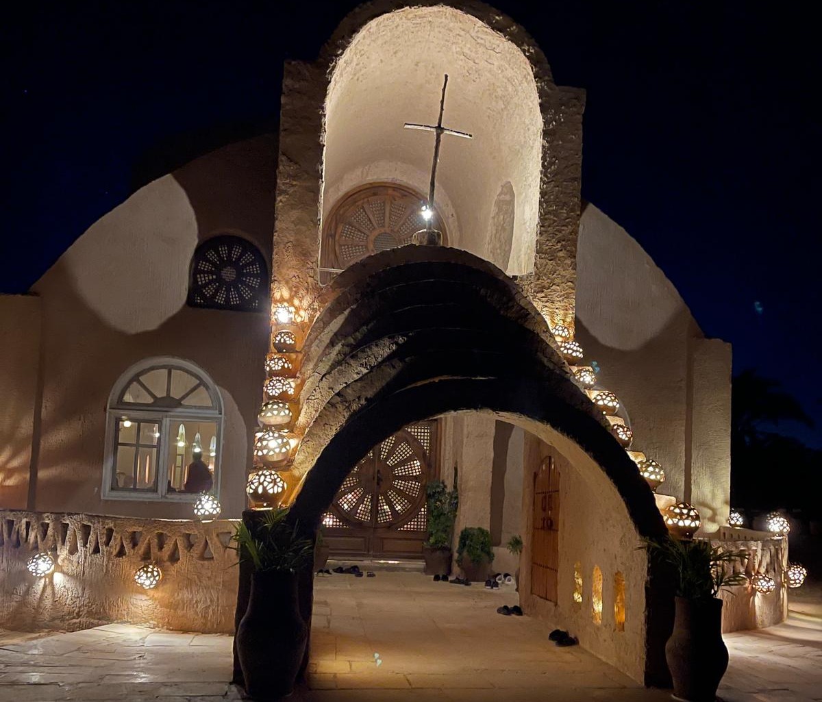 A church building with a wooden cross above the entrance