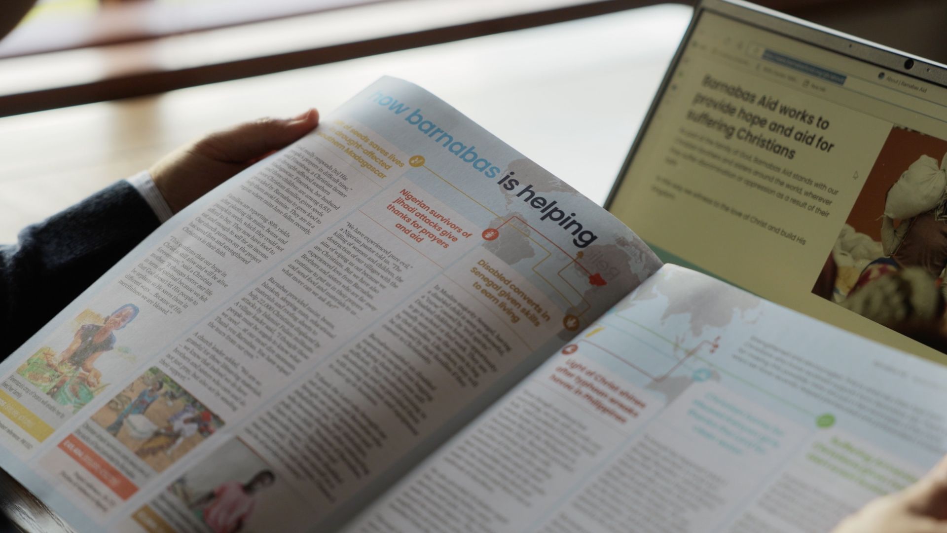 Timothy reads the Compassion in Action section of the Barnabas Aid magazine.