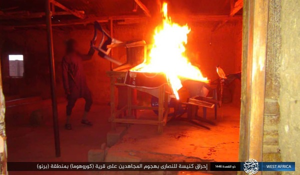 A man setting fire to a lectern and chairs inside a church building