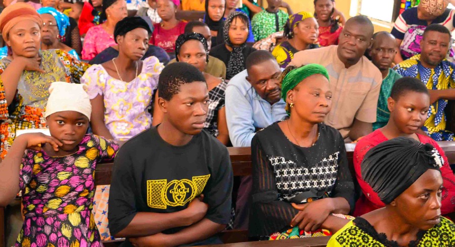 A group of men and women inside a church building