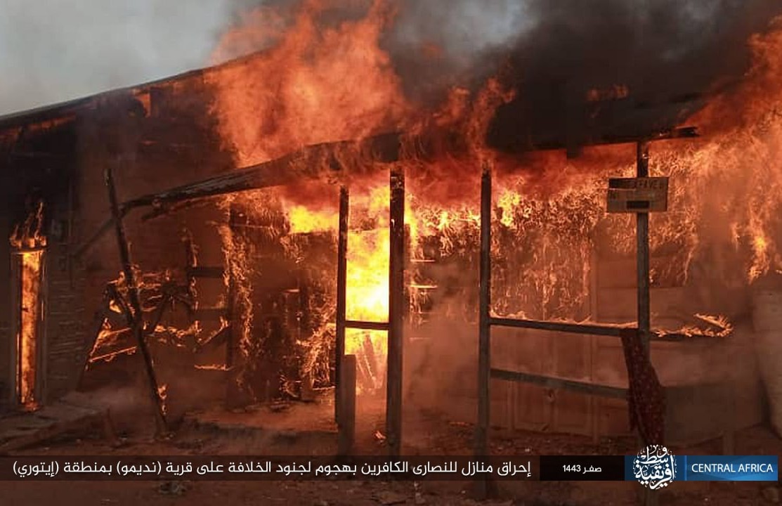A basic wooden building in flames