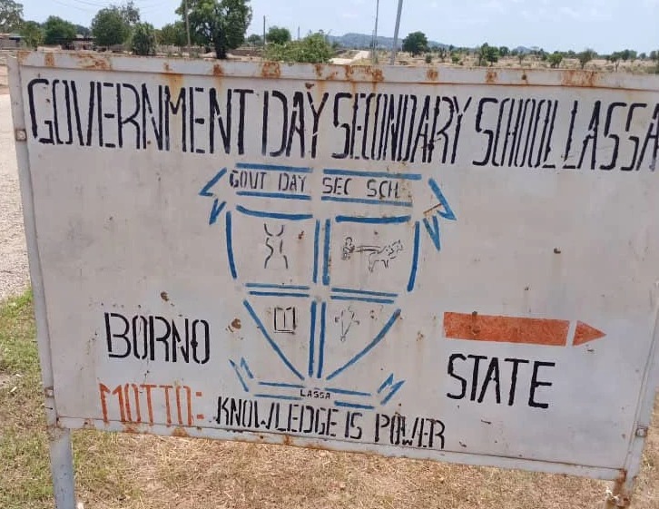 Sign with the text: GOVERNMENT DAY SECONDARY SCHOOL LASSA