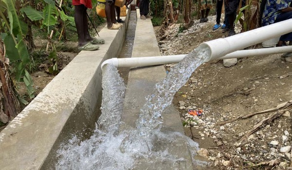 Water running from two new white water pipes