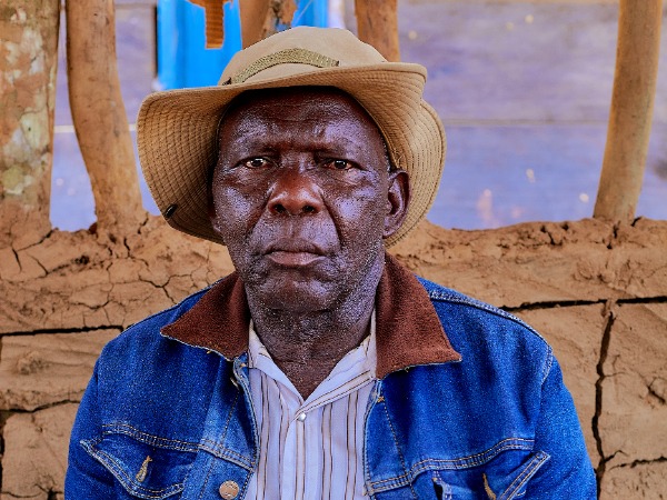 A man wearing a blue denim jacket