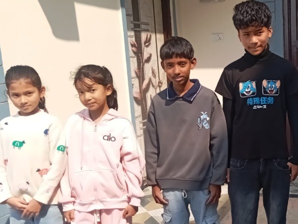 Two young girls and two older boys