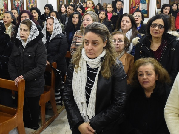 A group of women standing in a church service