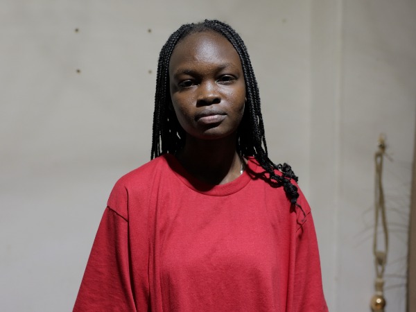 A woman in a red long-sleeve t-shirt