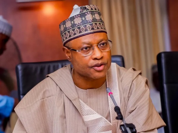 A man wearing glasses and traditional Nigerian clothes